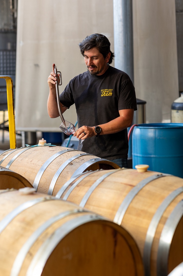 Man Tasting Wine from a barrel, winemaker, production